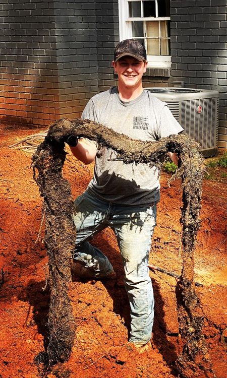 SepticRooter™ technician gets to the ROOT of the problem in Ball Ground — root-invaded septic pipe